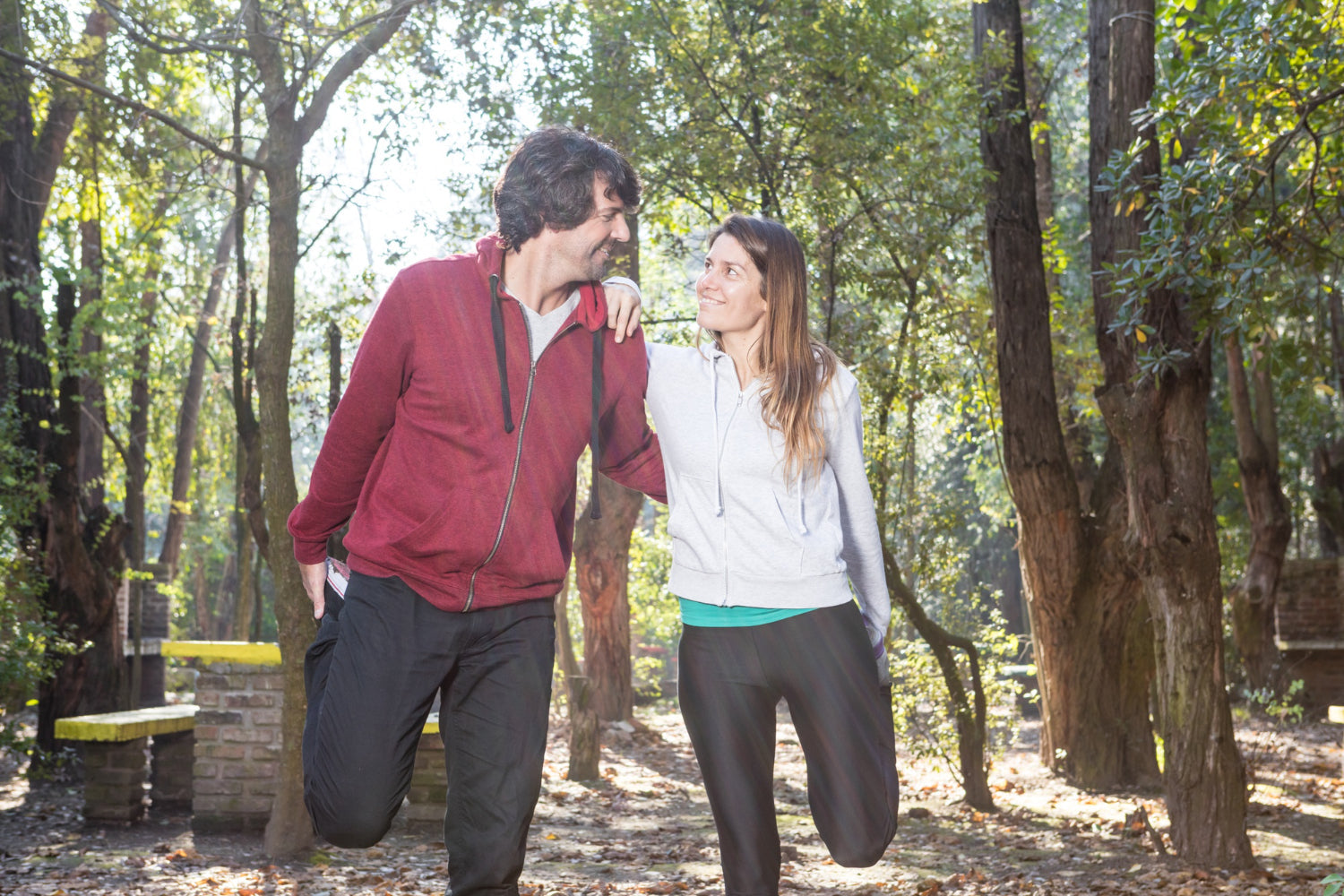 couple stretching muscles before exercise